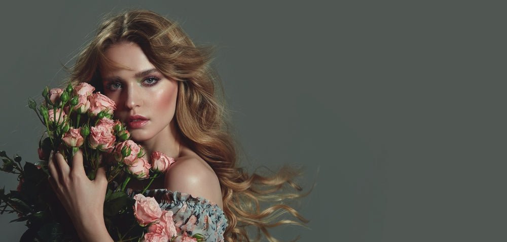 lady long red hair holding flowers
