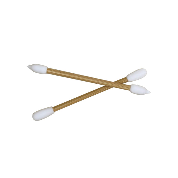 Reusable Makeup Swabs with eco-friendly silicone tips and bamboo handles crossed on a white background. Ideal for makeup application and removal.