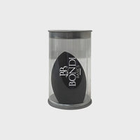 Light Touch Blender by Bondi Basics in black, packaged in a clear cylindrical container. Ideal makeup sponge for blending, contouring, and highlighting.