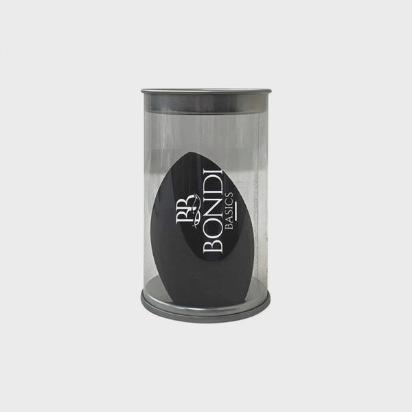 Light Touch Blender by Bondi Basics in black, packaged in a clear cylindrical container. Ideal makeup sponge for blending, contouring, and highlighting.