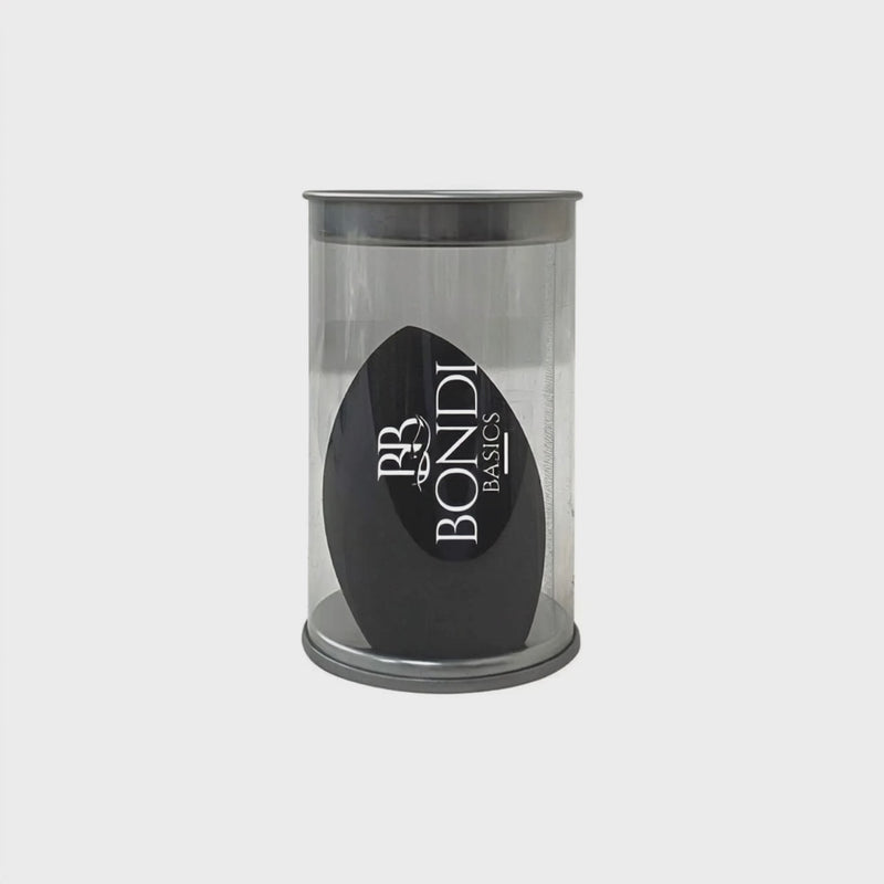 Light Touch Blender by Bondi Basics in black, packaged in a clear cylindrical container. Ideal makeup sponge for blending, contouring, and highlighting.